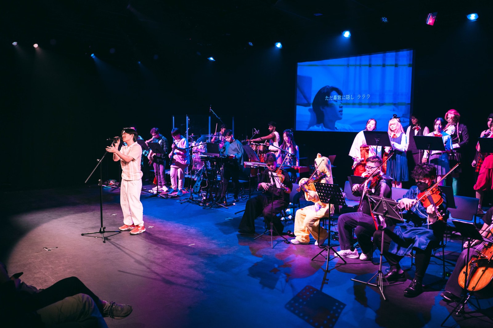 The AniMemori hybrid ensemble performing on stage